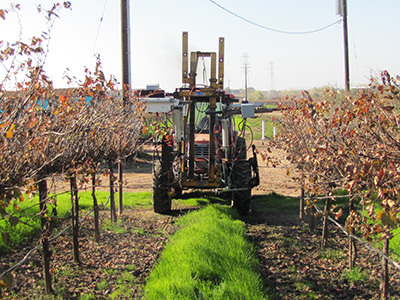 Tractor equipped with a robot arm